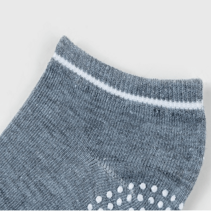 Close-up of grey sports anti-slip breathable women's sock with massage granules, SF0289, highlighting quality cotton and snug fit.